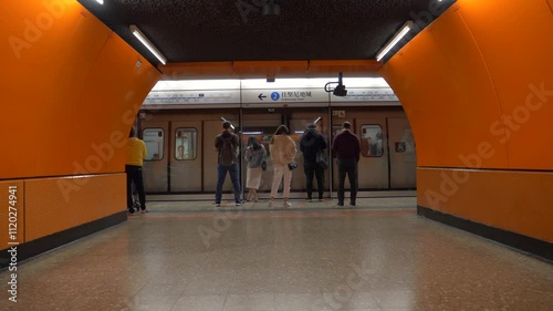 Passengers wait for the train arriving at Hong Kong underground station. Urban liife in China