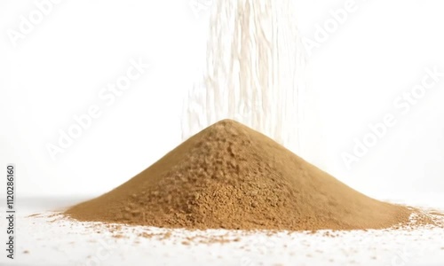 A mound of brown powder on a white background, suggesting a culinary or industrial ingredient.