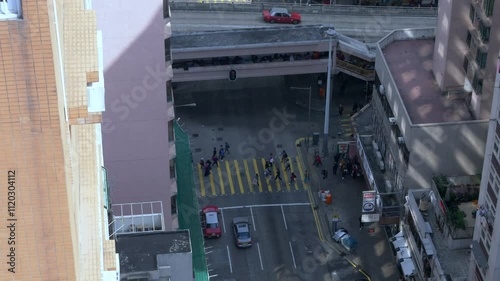 Urban scene with pedastrians and cars from a Hong Kong street, view from above