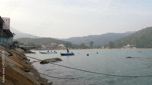 Hong kong harbour and boats in the water in fog daytime