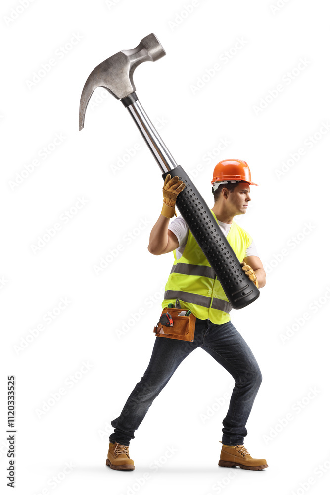 Construction worker holding a big hammer Construction worker holding a big hammer