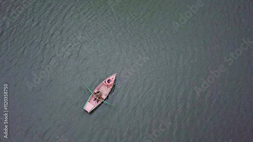 Quadro su tela A peaceful and serene rowboat gently floats on calm and tranquil waters, embodying relaxation
