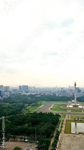 Video of Monumen Nasional (Monas) Indonesia. Footage of Monas areas from Perpustakaan Nasional (Perpusnas). Recorded from Indonesian library in Jakarta. Capital city in Indonesia. photo