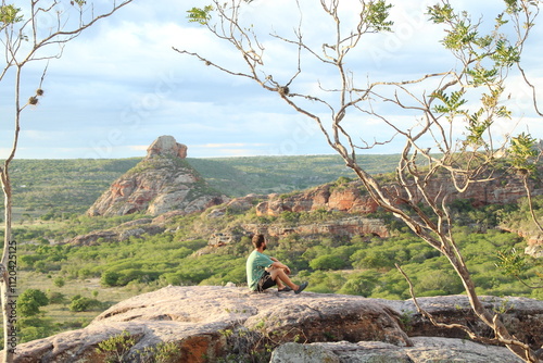 homem em mirante no vale do catimbau, pernambuco photo