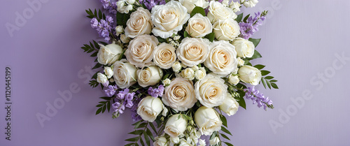 Elegant White Rose Bouquet with Lavender Flowers. Top view of a luxurious white rose bouquet accented with lavender flowers and greenery on a pastel purple background.