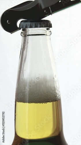 Opener removing the cap from a beer bottle