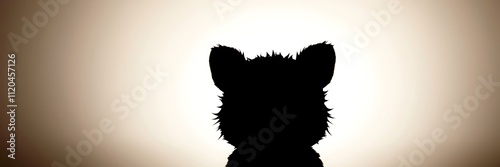 Silhouette of a Curious Kitten: image evokes sense of curiosity and wonder.