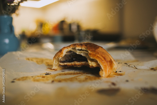 Top view of baking parchment with croissant marks. The grease stains and texture of the paper create an authentic look of the baking process. Perfect for visualizing cooking, home baking, and gastrono