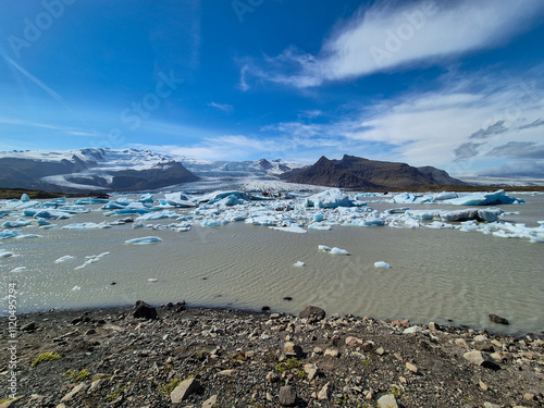 Melting glaciers and shimmering icebergs in a pristine Icelandic natural reserve photo