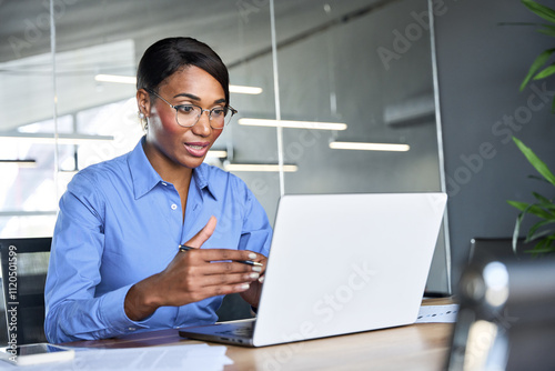 Busy African American business woman hr manager having online job interview, bank worker or financial advisor consulting client investor during virtual corporate office hybrid call meeting.