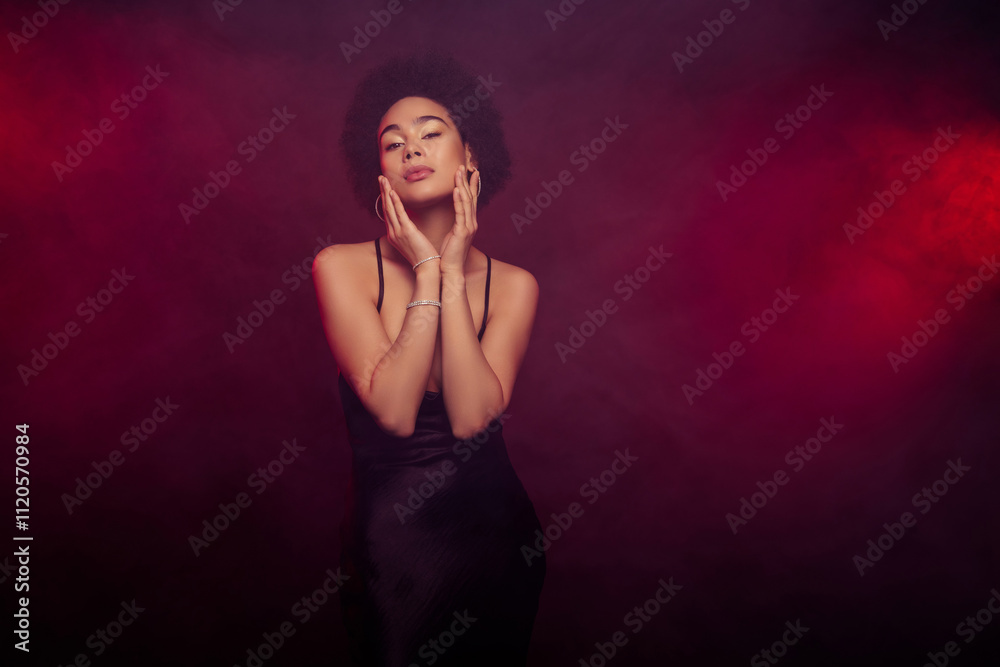 Photo of happy attractive stunning touch face sensual model dressed black dress isolated on burgundy color background Photo of happy attractive stunning touch face sensual model dressed black dress isolated on burgundy color background