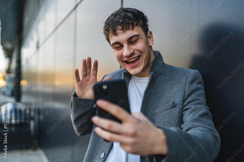 young man have video call on mobile phone in front black wall outdoor young man have video call on mobile phone in front black wall outdoor