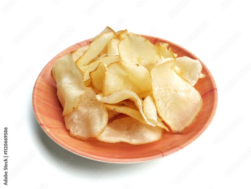 Keripik singkong or cassava chips on plate isolated on white background Keripik singkong or cassava chips on plate isolated on white background