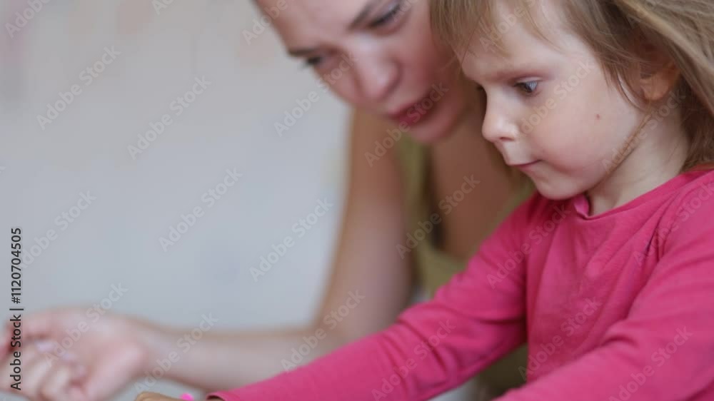 woman mother with three year old child playing educational games drawing at home woman mother with three year old child playing educational games drawing at home