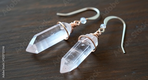 Quartz crystal earrings with raw edges and minimalist wire wrapping photo