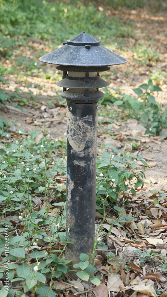 Weathered Outdoor Path Light in Lush Greenery Weathered Outdoor Path Light in Lush Greenery