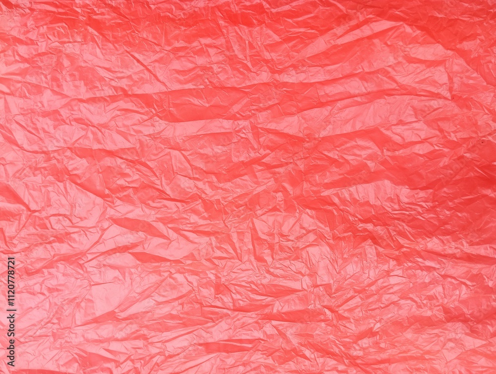 Red crumpled plastic bag texture and background Red crumpled plastic bag texture and background