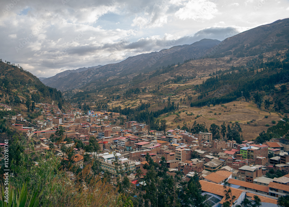 Small town in the middle of greenish mountains in the South American highlands on a cloudy winter's day Small town in the middle of greenish mountains in the South American highlands on a cloudy winter's day