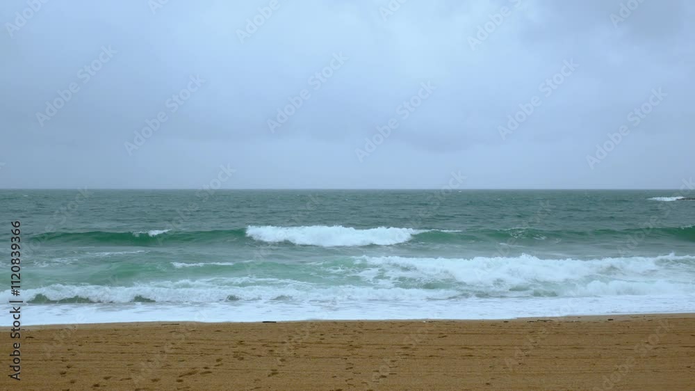 Biarritz coastline with beach blue sea and overcast rainy weather Biarritz coastline with beach blue sea and overcast rainy weather