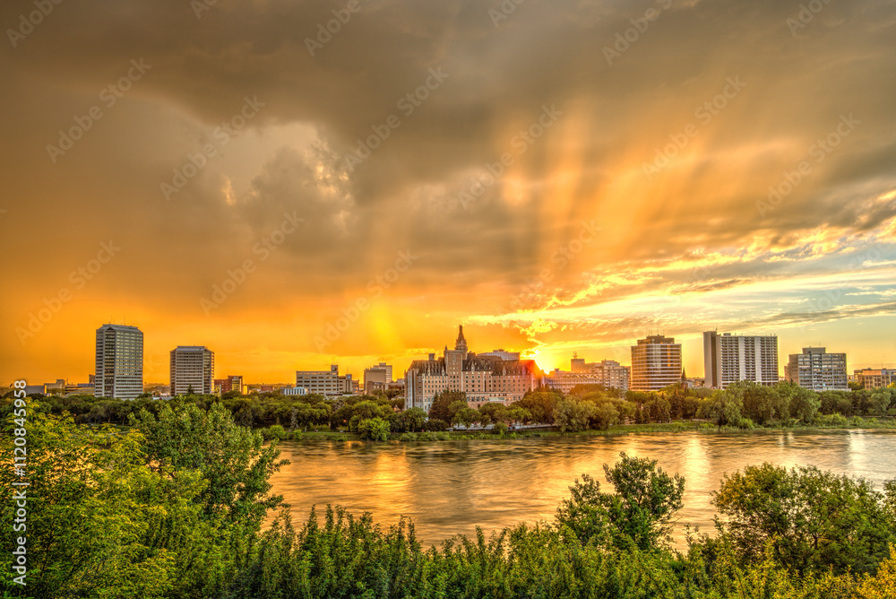 A city skyline is reflected in the water, with the sun setting in the background A city skyline is reflected in the water, with the sun setting in the background