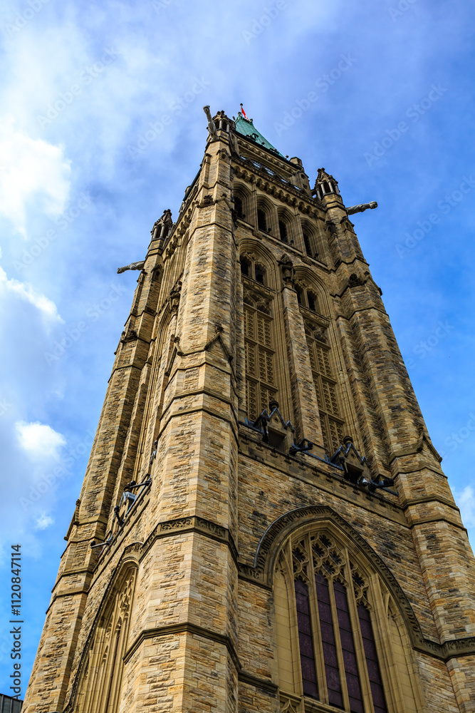 Fototapeta premium A tall, brown building with a green dome on top