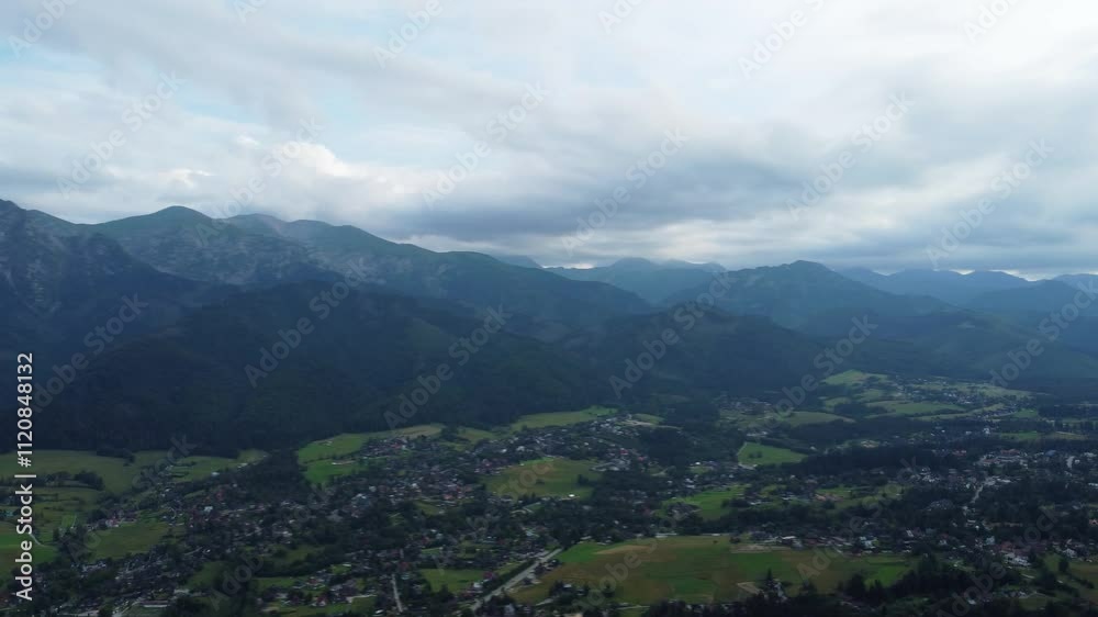 Tatra mountains and village in Zakopane region, aerial view Tatra mountains and village in Zakopane region, aerial view