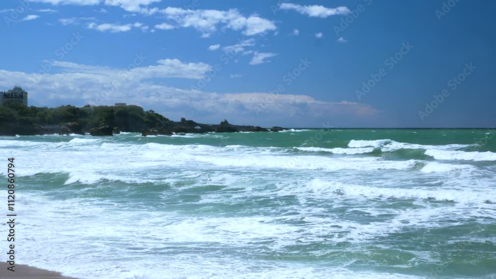 Coastal view of Biarritz on a sunny day with a beach and blue sea Coastal view of Biarritz on a sunny day with a beach and blue sea