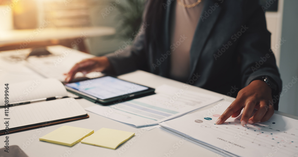 Person hands, tablet and paper in office for business, financial planning and data analysis at night. Woman, tech or documents with graphs for growth projection, company development or audit deadline Person hands, tablet and paper in office for business, financial planning and data analysis at night. Woman, tech or documents with graphs for growth projection, company development or audit deadline