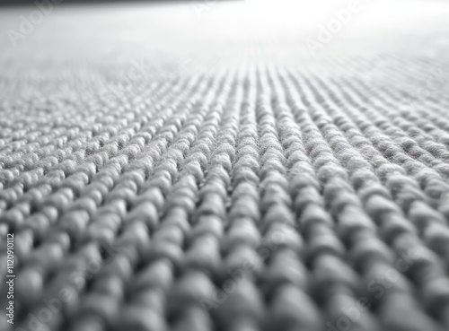 High-resolution close-up of sleek low-pile gray carpet texture for modern interior design.