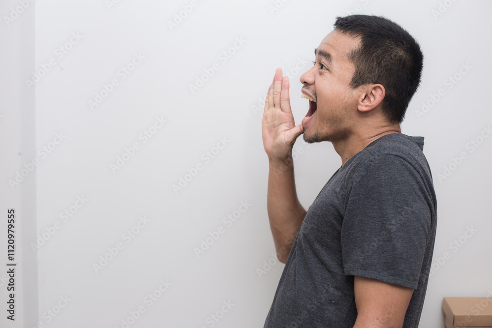 Portrait of business asian man make mount shout out from hand facial face Portrait of business asian man make mount shout out from hand facial face