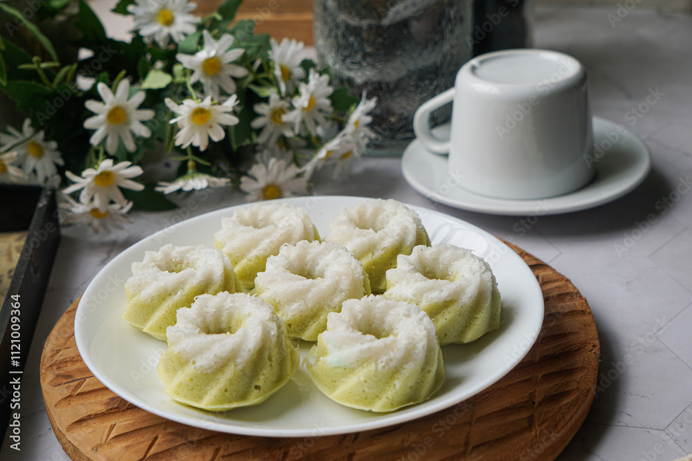 Kuih Puteri Ayu, a popular traditional Malaysian steamed sponge pandan coconut cake. Kuih Puteri Ayu, a popular traditional Malaysian steamed sponge pandan coconut cake.