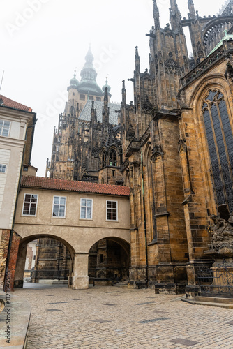 Medieval buildings attached to the impressive St. Vitus Cathedral in Prague, a monumental complex.