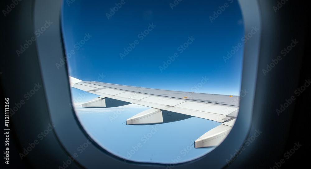 Airplane wing against clear blue sky Airplane wing against clear blue sky