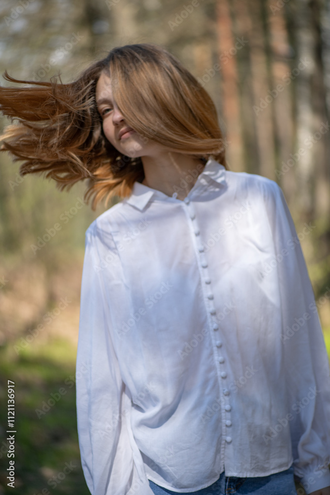 Young beautiful girl in a white shirt in the forest. Young beautiful girl in a white shirt in the forest.