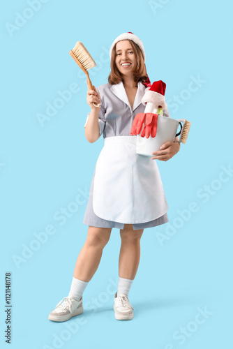 Young chambermaid with Sant...