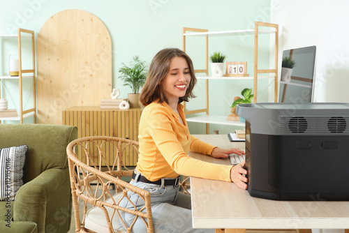 Young woman with portable p...