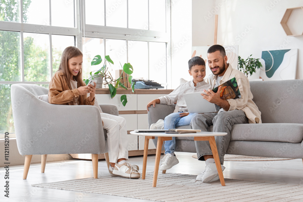 Cute little children with their father spending time together at home Cute little children with their father spending time together at home