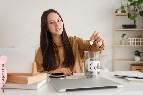 Young woman with savings for education at home