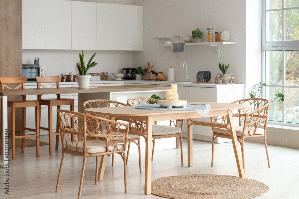 Stylish interior of kitchen with candles on dining table Stylish interior of kitchen with candles on dining table