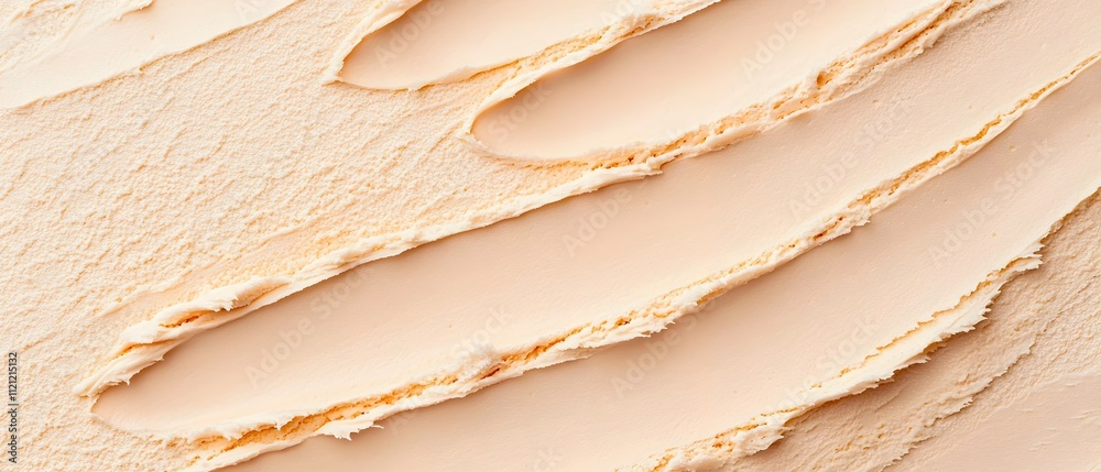 A tube of makeup is shown with a brush on it A tube of makeup is shown with a brush on it