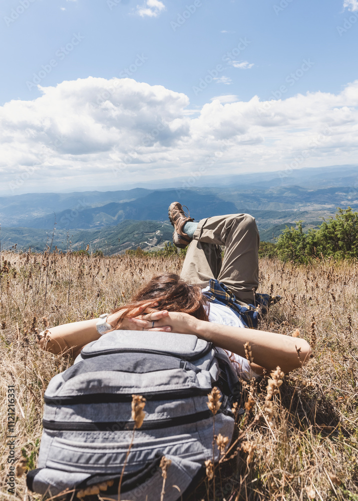 Φωτογραφία Young woman lying in the relaxing enjoying the view of mountain summer nature an