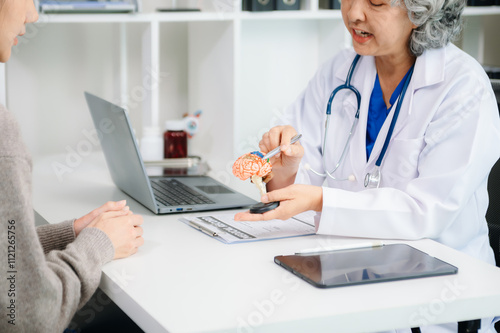 Senior doctor performing a medical checkup on a patient. Perfect for healthcare, medical, caregiving