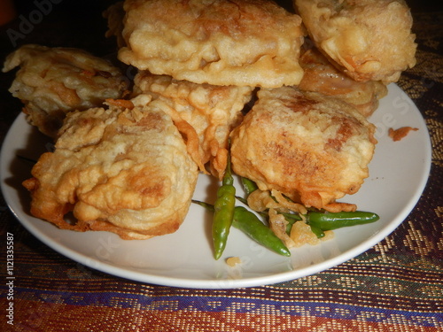 Stuffed tofu atau tahu isi , a food from Indonesia is tofu stuffed with various kinds of vegetables such as cabbage, carrots, bean sprouts and fried in flour served with raw green chilies.