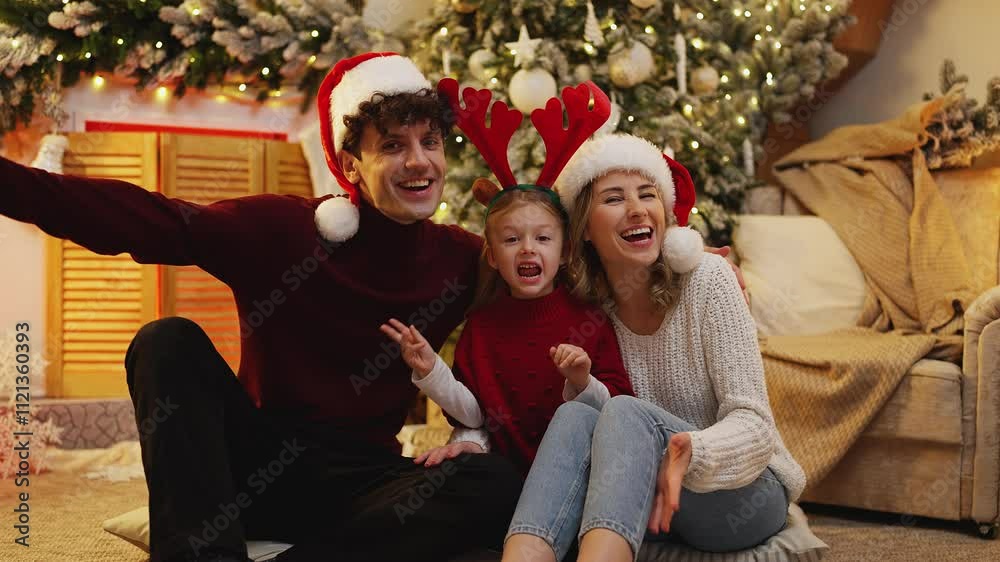 Portrait of a family in party hats, sending Christmas and New Year greetings Portrait of a family in party hats, sending Christmas and New Year greetings