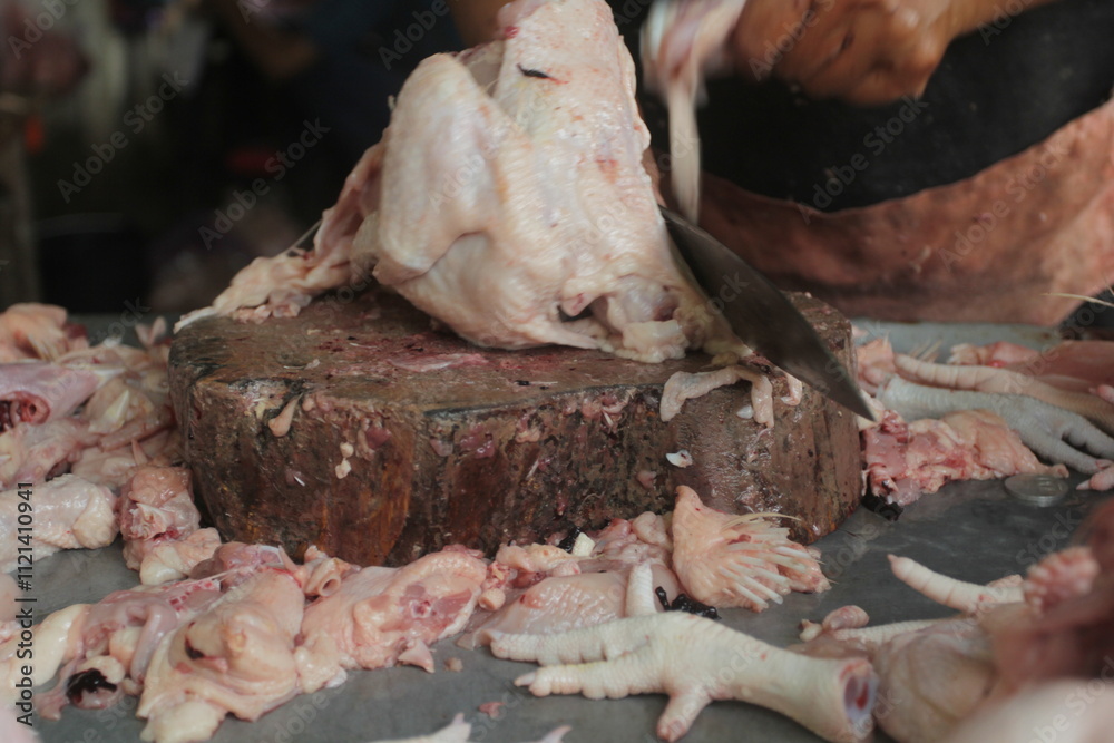 © afifah - butcher cutting fresh chicken © afifah - butcher cutting fresh chicken