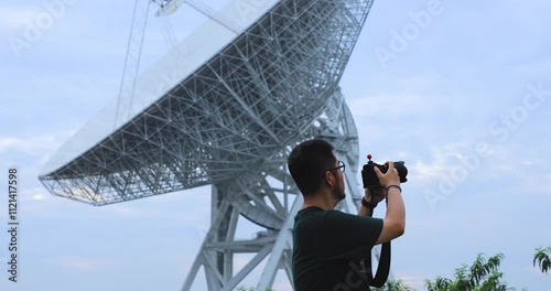 Young people next to the Tianmashan radio telescope in Songjiang District, Shanghai photo