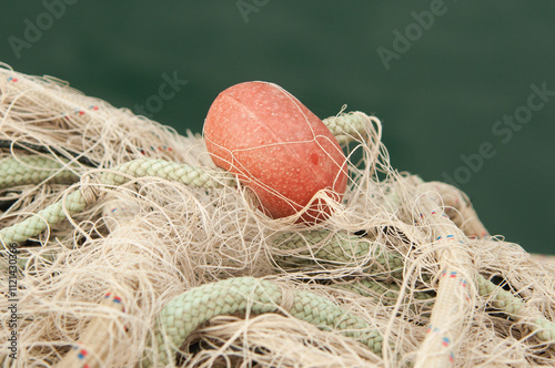 A close up of a fish net with sea in Menidi Aitolokarnania Greece photo