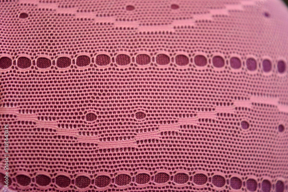 Unusual materials, backgrounds, synthetic fabrics. Purple thin fabric mesh is located on purple glossy fabric. Unusual materials, backgrounds, synthetic fabrics. Purple thin fabric mesh is located on purple glossy fabric.