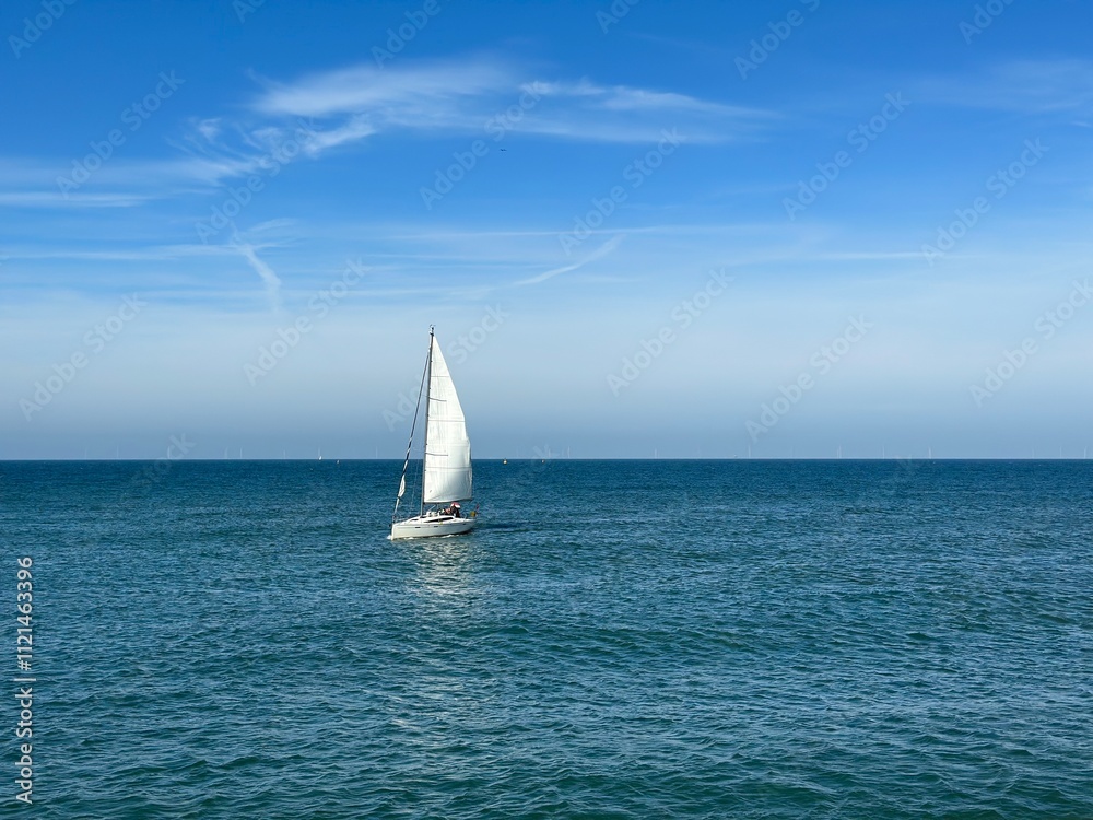 A lonely sailboat in the North Sea in the Hague