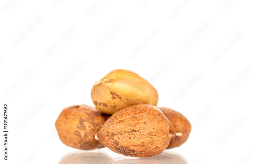 Several hazelnuts, close-up, isolated on white background. Several hazelnuts, close-up, isolated on white background.